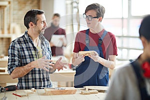 Carpenter Talking to Apprentice