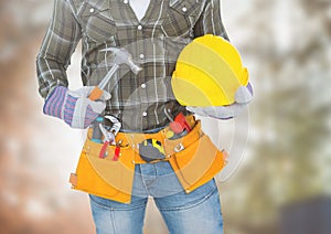 Carpenter with tools on building site