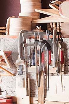 Carpenter tools fixed on the wall at workshop