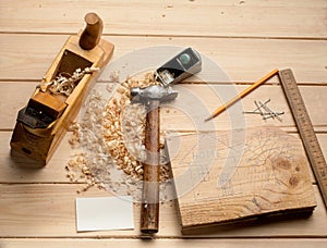 Carpenter tools,hammer,meter, nails,shavings, and