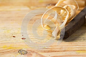 Carpenter tools on wood table background with sawdust. Copy space