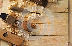 Carpenter tools on wood table background. Top view. Copy space