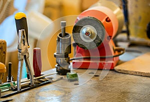 Carpenter tools on wooden table with sawdust