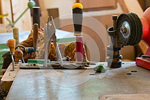 Carpenter tools on wooden table with sawdust