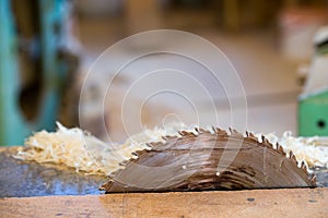 Carpenter tools on wooden table with sawdust. Circular Saw. Cutting a wooden plank