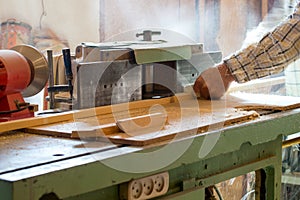 Carpenter tools on wooden table with sawdust. Circular Saw. Cutting a wooden plank