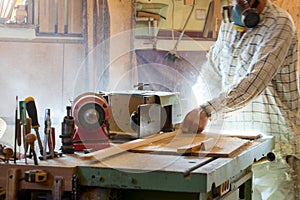 Carpenter tools on wooden table with sawdust. Circular Saw. Cutting a wooden plank