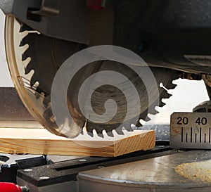 Carpenter tools on wooden table with sawdust. Circular Saw. Cutting a wooden plank