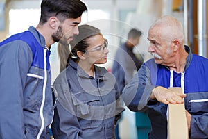 carpenter trainees learning with boss