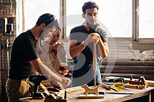 Carpenter Training Female Apprentice To Use Plane