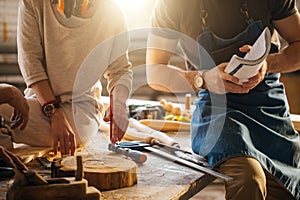 Carpenter Training Female Apprentice To Use Plane