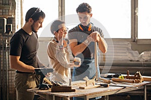 Carpenter Training Female Apprentice To Use Plane