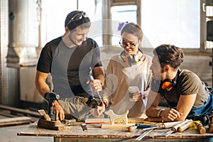 Carpenter Training Female Apprentice To Use Plane