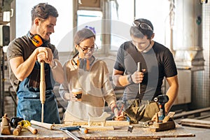 Carpenter Training Female Apprentice To Use Plane