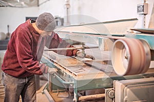 Carpenter using belt sander