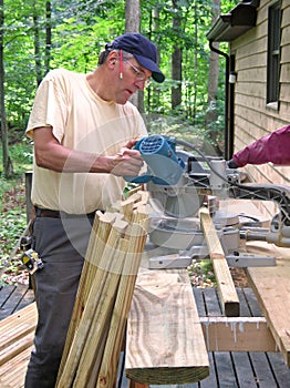Carpenter using chop saw