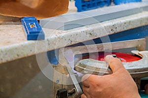 Carpenter using circular saw for cutting wooden boards with hand power tools