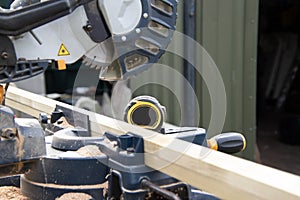 Carpenter using circular saw in DIY project