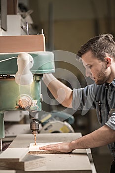 Carpenter using drill