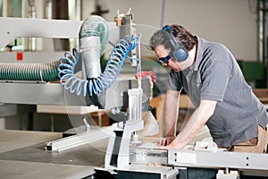 Carpenter using electric saw