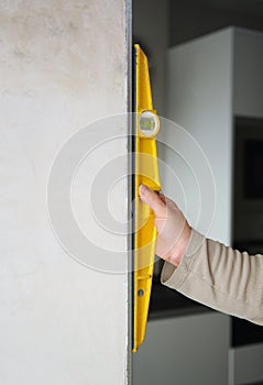 Carpenter using the level tool