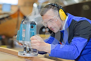 carpenter using router