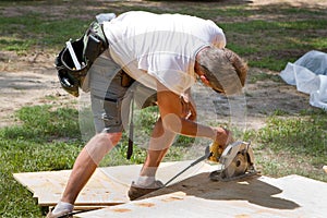 Carpenter Using Saw photo