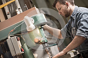 Carpenter using sawing machine