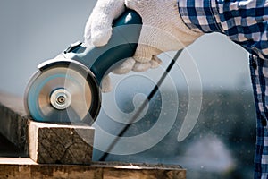 Carpenter using tools saw electric cutting wood