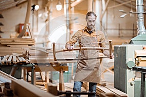 Carpenter with vintage handsaw