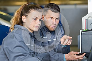 carpenter woman and man in workshop