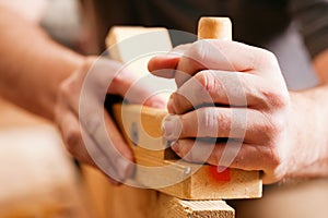 Carpenter with wood planer