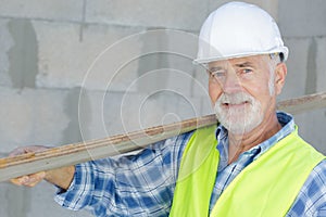 carpenter with wooden planks