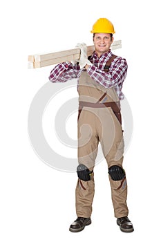 Carpenter with wooden planks