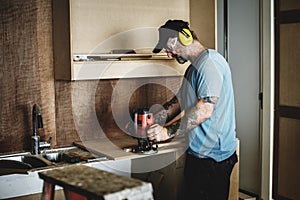 Carpenter woodworker working for house renovation photo