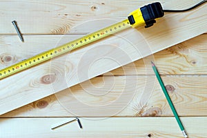 Carpenter work concept. Measuring tape on table.