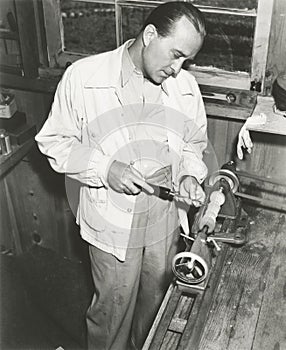 Carpenter at work in his woodshop