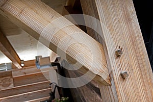 Carpenter at work outdoors Building materials. Wood construction with beams