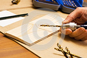 Carpenter at work to dill pine wood