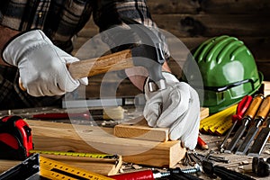 Carpenter at work on wooden boards. Carpentry