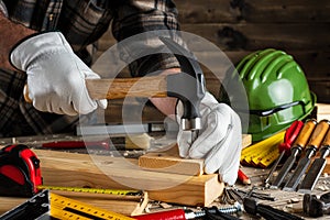 Carpenter at work on wooden boards. Carpentry