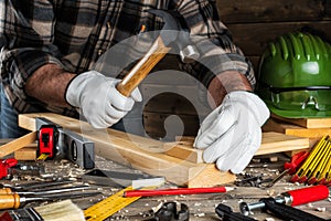 Carpenter at work on wooden boards. Carpentry