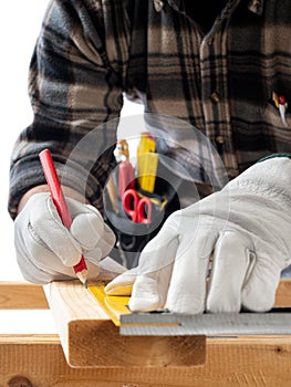 Carpenter at work on wooden boards. Carpentry