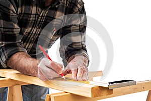 Carpenter at work on wooden boards. Carpentry