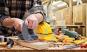 Carpenter at work on wooden boards. Carpentry