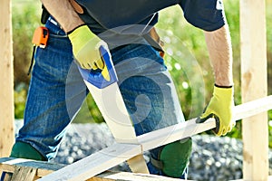 Carpenter worker cutting wood board