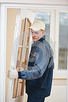 Carpenter worker at door installation