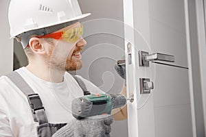 Carpenter worker installation process of wood door hinge