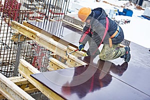 Carpenter worker preparing construction formwork photo