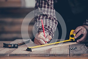 Carpenter working in carpentry shop. Woodwork for furniture and home decor